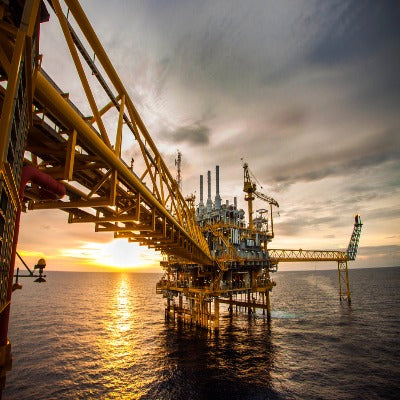 Oil rig in the ocean on an overcast day