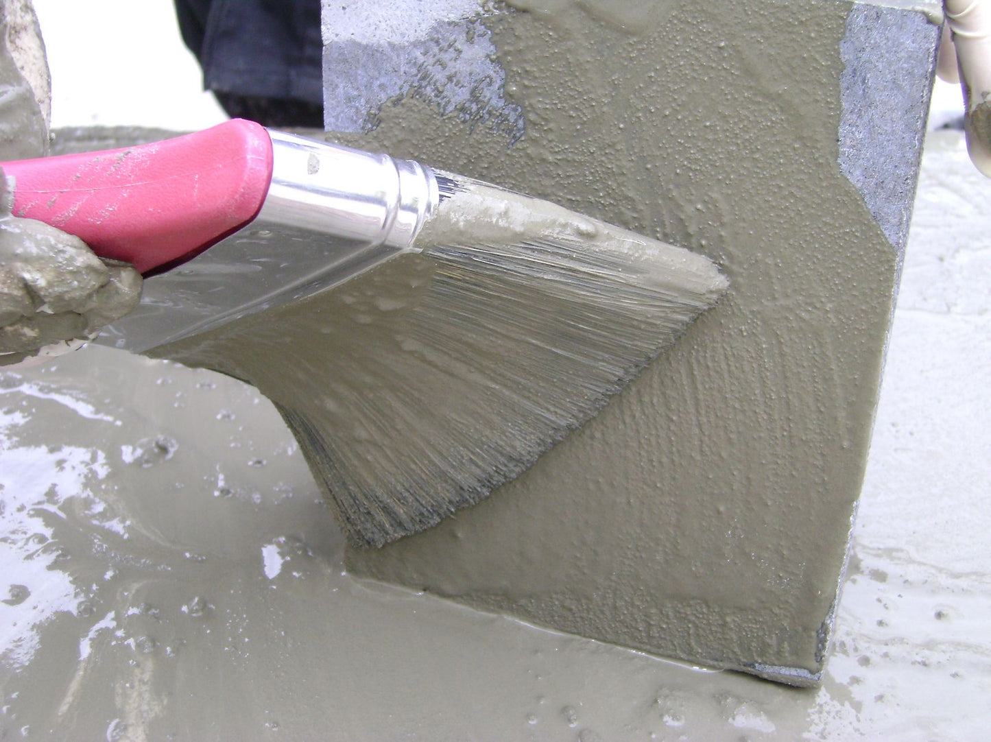 Applying Pro-Prime Slurry Primer with a brush